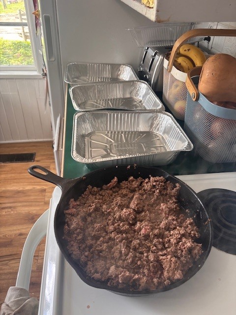 aluminum lasagna pans laid out on counter ready for adding lasagna ingredients