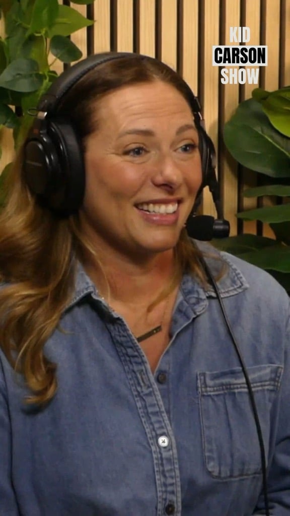 thumbnail image of woman with light brown wavy hair, medium denim shirt and headphones on ready for recorded interview